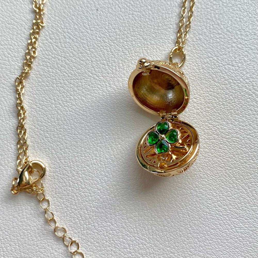 Elegant Gold Locket Necklace with Green Gemstones